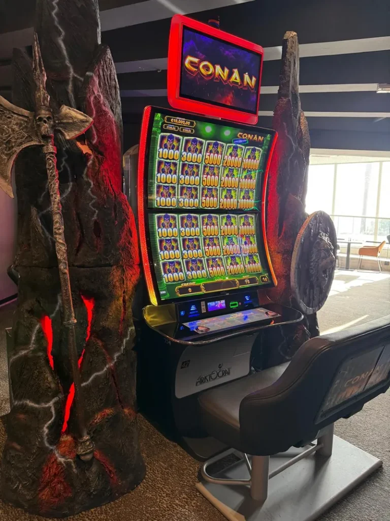 Tall slot machine on the gaming floor at Casino JOA d'Argelès