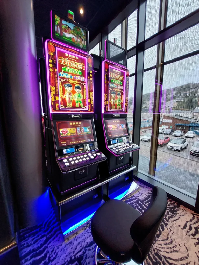 Slot machines beside panoramic windows at Casino JOA de Fécamp