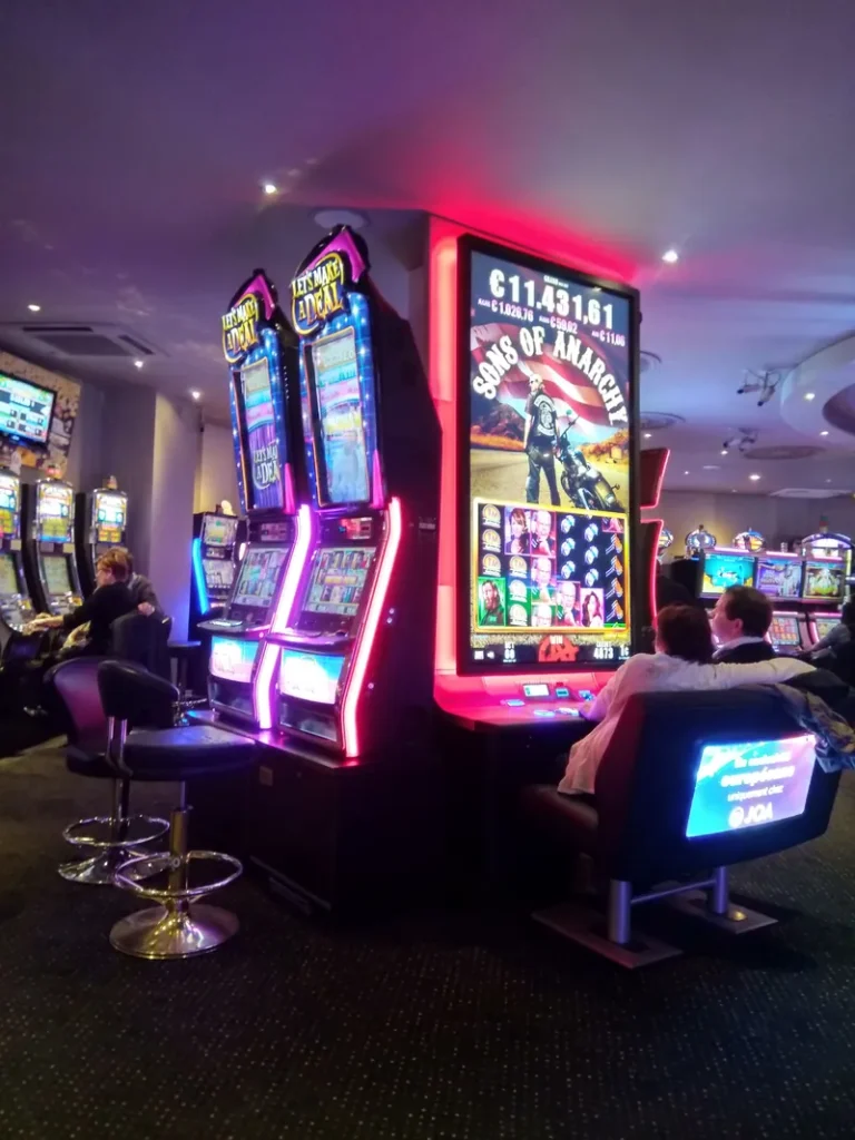 Purple-lit gaming machines at Casino JOA de Luxeuil