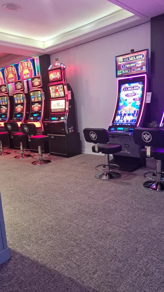 Pink-lit slot machine room at Casino JOA de Saint-Jean-de-Monts
