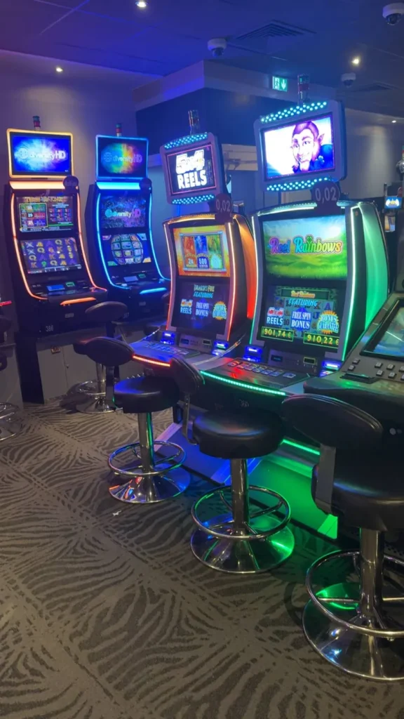 Blue-lit gaming machines at Casino JOA de Santenay