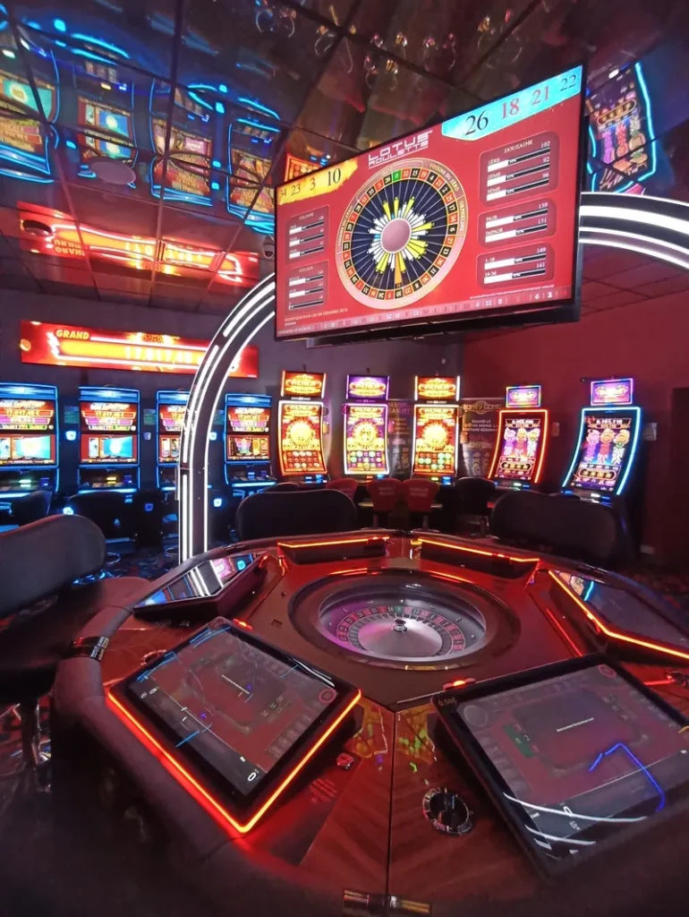 Red slot machines on the gaming floor at Casino de Barbazan