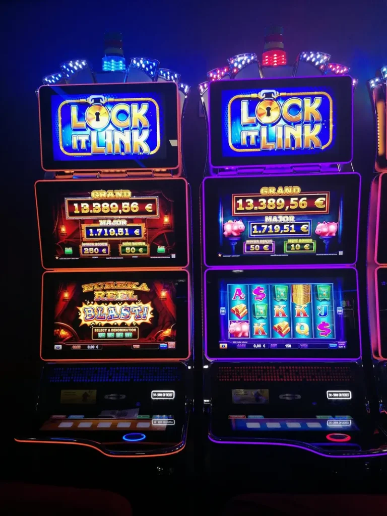 Pair of glowing slot machines at Casino de Barbazan