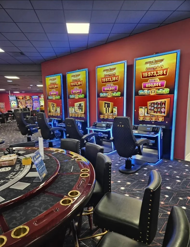 Red slot machines in the gaming area at Casino de Fort-Mahon-Plage