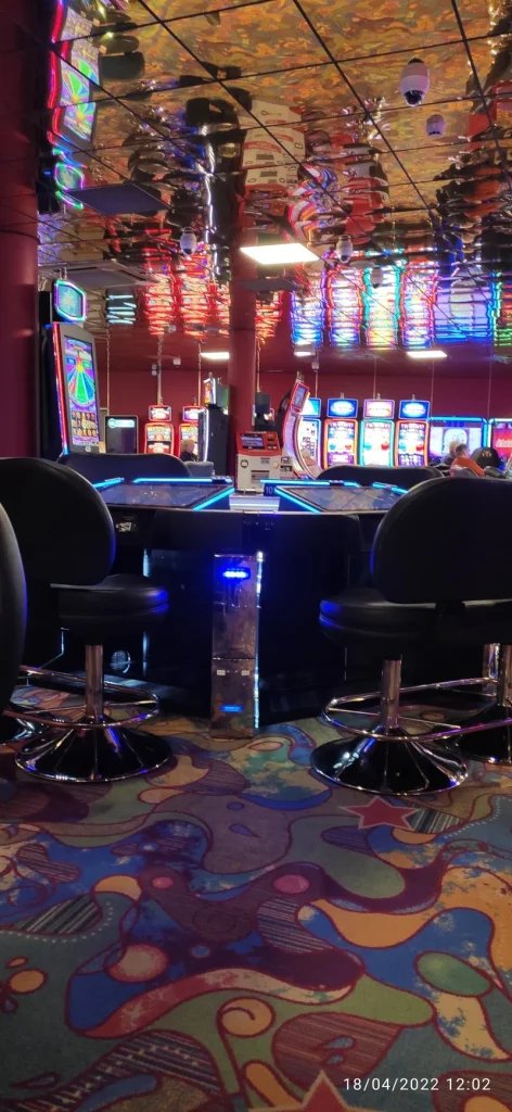 Colourful gaming floor with slot machines at Casino Les Atlantes