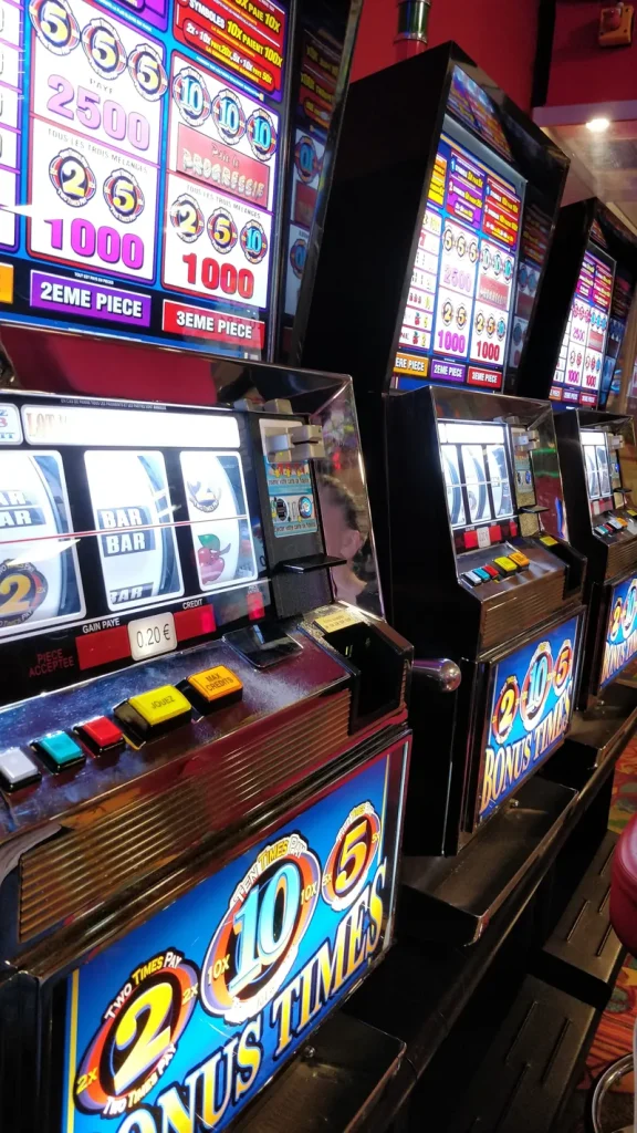 Close view of illuminated slot machines at Casino Les Atlantes