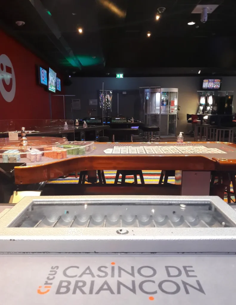 Gaming tables beside the casino bar at Circus Casino Briançon
